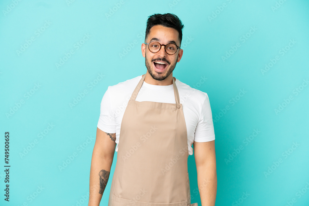 Restaurant waiter caucasian man isolated on blue background with surprise facial expression Restaurant waiter caucasian man isolated on blue background with surprise facial expression