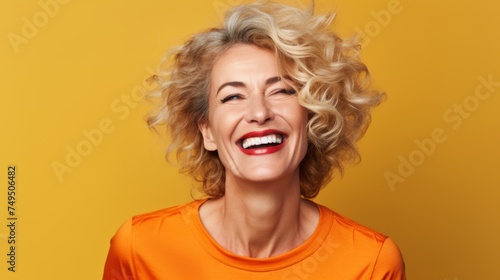 portrait of happy and laughing middle aged pretty woman