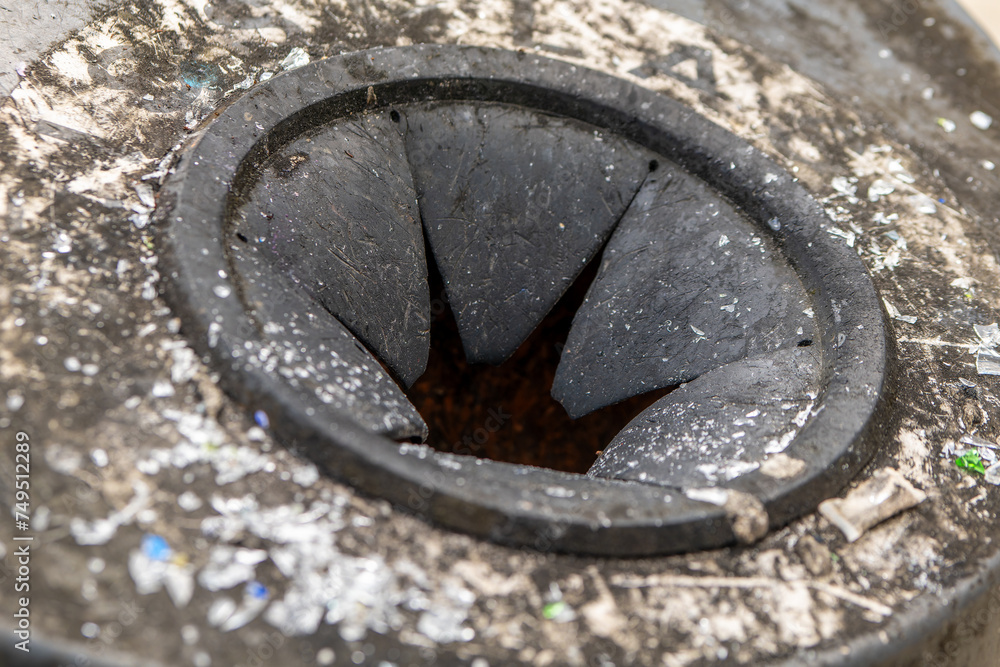 thrown in front of a glass container with glass splinters thrown in front of a glass container with glass splinters
