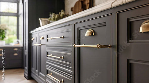 A kitchen cabinet with brass handles, creating a chic and timeless look in the room. photo