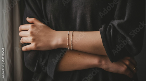 woman's wrist adorned with a simple yet elegant chain bracelet