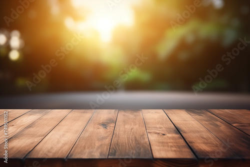 The empty wooden table top with a blurred background