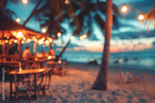 Blur and bokeh of beach bar restaurant in the evening. Abstract defocused background. © Victoria