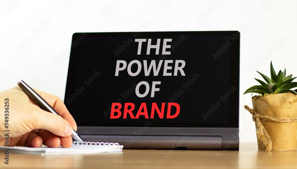 The power of brand symbol. Concept words The power of brand on beautiful black tablet. Beautiful white background. Businessman hand. Calculator. Business the power of brand concept. Copy space. The power of brand symbol. Concept words The power of brand on beautiful black tablet. Beautiful white background. Businessman hand. Calculator. Business the power of brand concept. Copy space.