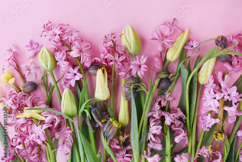 Blossoming pink hyacinths and spring tulips flowers festive background, bright springtime bouquet floral card, selective focus
