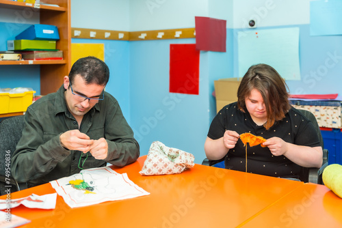 Canvas Print People with intellectual disabilities knitting clothes with wool