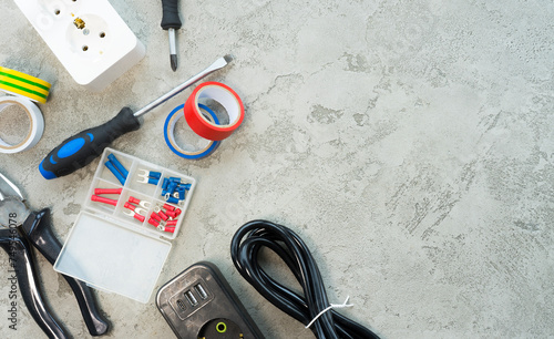 Electrical items on gray concrete background