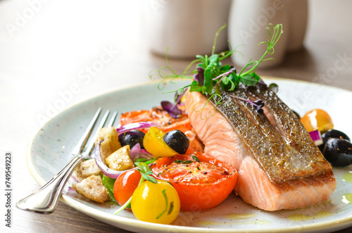 grilled fish salmon with vegetables, color food, healthy, tomatoe, olive, fresh food, serving , restaurant photo