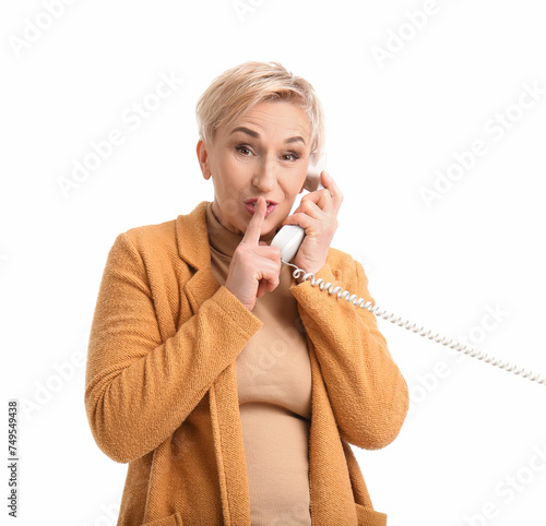Mature woman talking by tel...