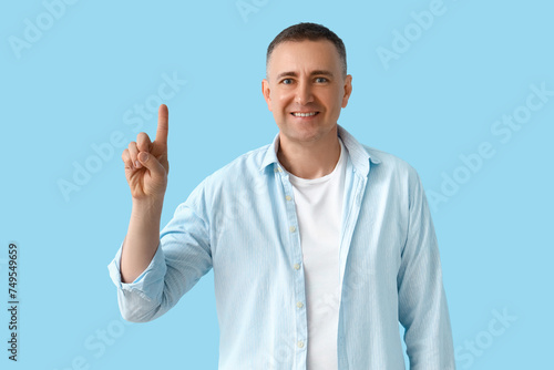 Mature man pointing at some...