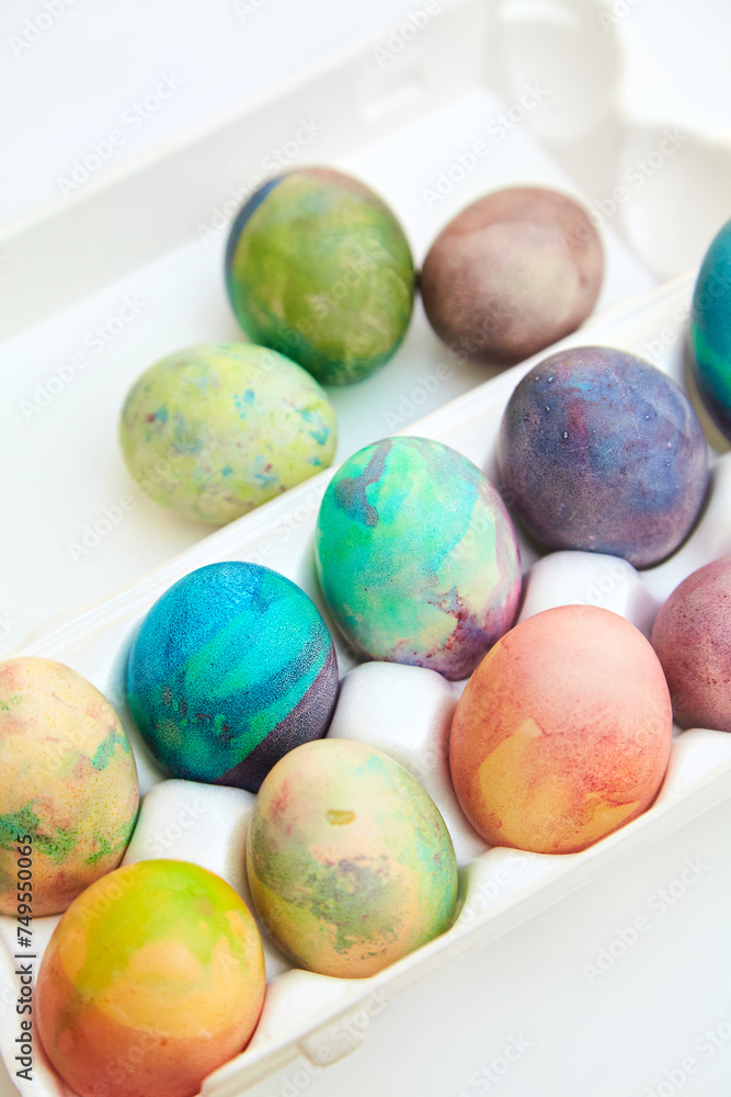 Group of Easter painted eggs in white container Group of Easter painted eggs in white container
