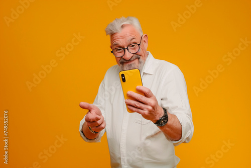white man pointing down at a yellow phone