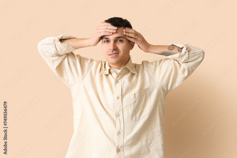 Young man with brain concussion on beige background Young man with brain concussion on beige background