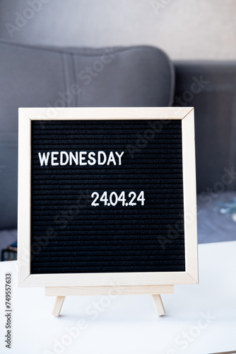 Beautiful date for a wedding 04/24/2024 on a black letterboard on the table