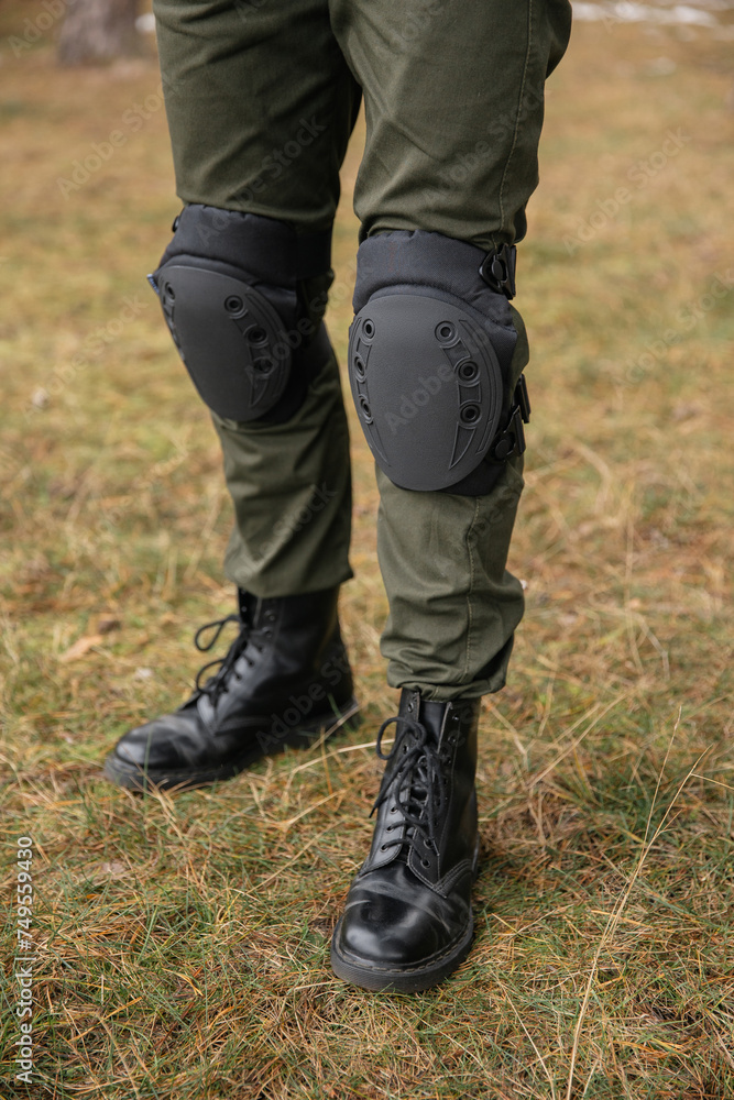 Tactical knee pads protect the legs of soldiers and warriors. Camouflage gear for convenience Tactical knee pads protect the legs of soldiers and warriors. Camouflage gear for convenience
