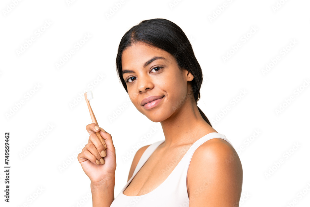 Young woman over over isolated chroma key background with a toothbrush Young woman over over isolated chroma key background with a toothbrush