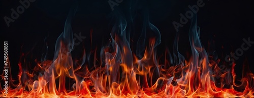 Burning red fire with smokes on dark background 