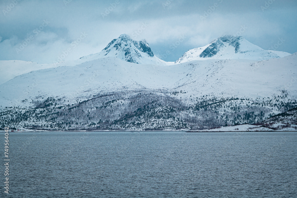 Detailed image of snow-capped mountains along a norwegian fjord on the Lofoten, northern Norway Detailed image of snow-capped mountains along a norwegian fjord on the Lofoten, northern Norway