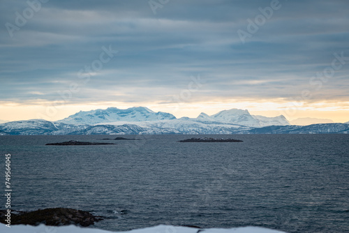 Magnificent views of distant snow-capped mountains on Vestfjorden on the Lofoten Islands in Norway