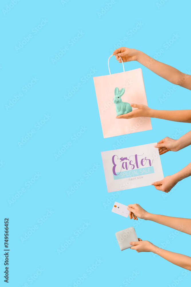 Women with shopping bag, credit card and wallet on blue background. Easter Sale Women with shopping bag, credit card and wallet on blue background. Easter Sale