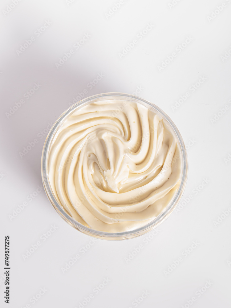 Body cream or butter in jar on white background. Top view Body cream or butter in jar on white background. Top view
