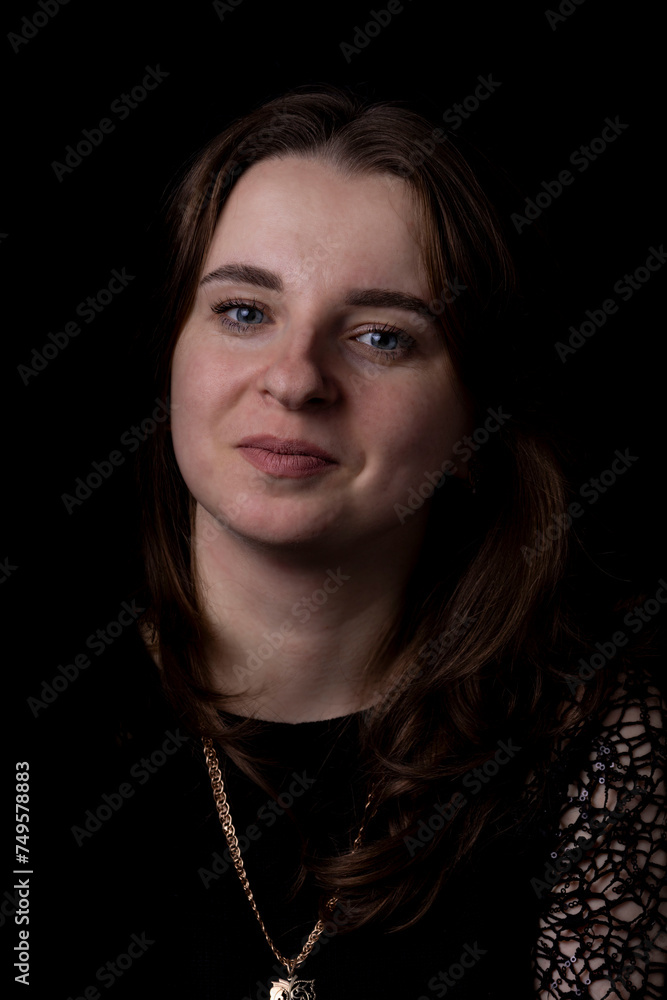 Portrait of a beautiful girl on a black background Portrait of a beautiful girl on a black background