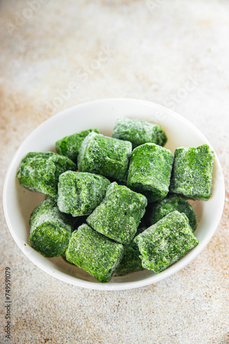 frozen spinach portion cube semifinished fresh food tasty healthy eating cooking meal snack on the table copy space food background rustic top view keto or paleo