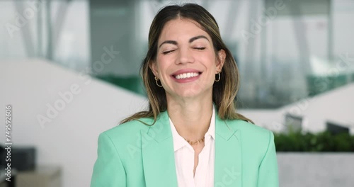 Latina businesswoman in elegant jacket posing in modern workplace smile staring at cam feel happy with work result. Independent, confident businesslady, professional company worker, head shot portrait