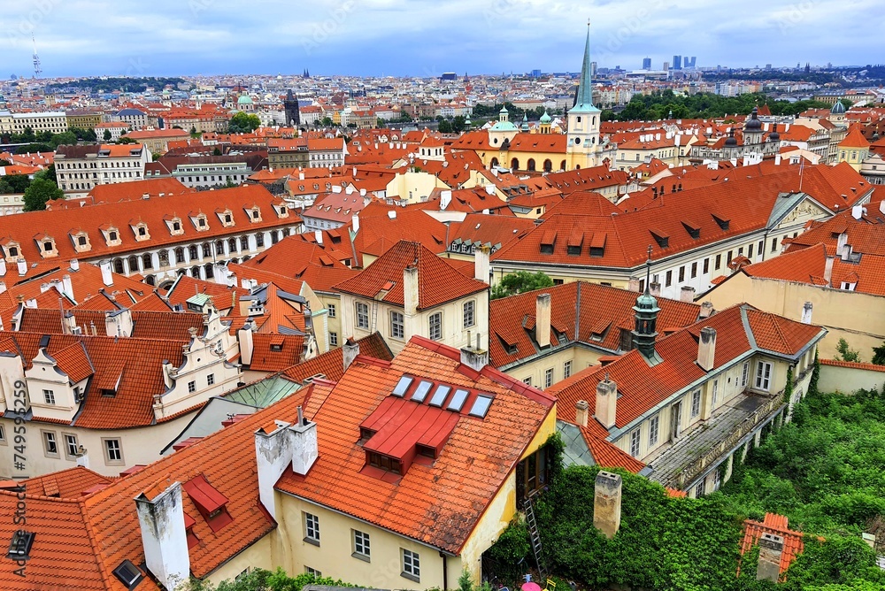 Prague, Czech Republic. Mala Strana, Old Town of Prague. Top view of downtown, panorama. Ancient old buildings with red tiled roofs, church, tower
