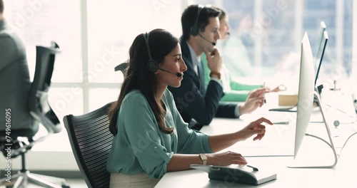 Pretty Brazilian woman employee in headset, providing excellent customer service on-line, give consultation through call in call center office, resolving inquiries, help solve issues of company client