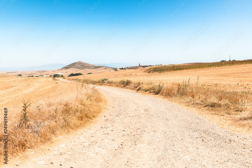French Way of Saint James - a gravel road with a view to Granon (on the way to Redecilla del Camino), comarca of Santo Domingo de la Calzada, La Rioja, Spain