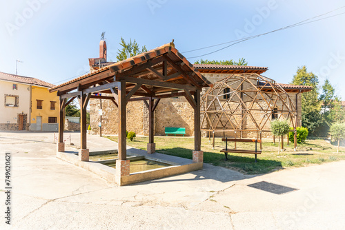 Old traditional public laundry at the main square close to the chapel of San Roque in Villambistia village, province of Burgos, Castile and Leon, Spain