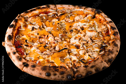 Italian food pizza with chicken, onion, sweet pepper, cheese, sunflower seeds and spices on a black background