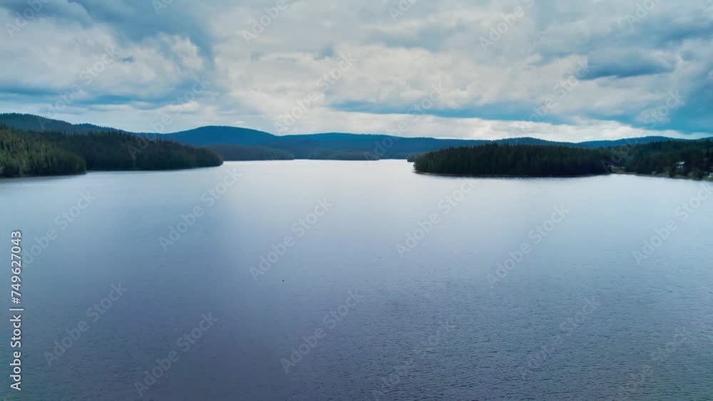 Aerial shot over a lake in the mountain on a cloudy summer day, Rhodope Bulgaria Aerial shot over a lake in the mountain on a cloudy summer day, Rhodope Bulgaria