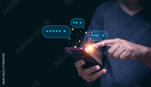 Digital online communication and social media concept, Businessman using application chat on smartphone for online marketing. Chatting to find information about products and services. photo