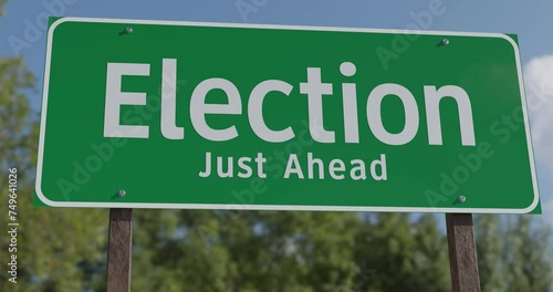 4k Pan Drive Past Election Just Ahead Green Road Sign.  photo