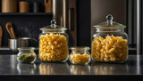 glass jars with dry assorted pasta in the kitchen rustic