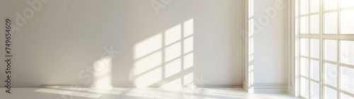 A White Room with a Corner Window, Illuminated by Golden Light photo