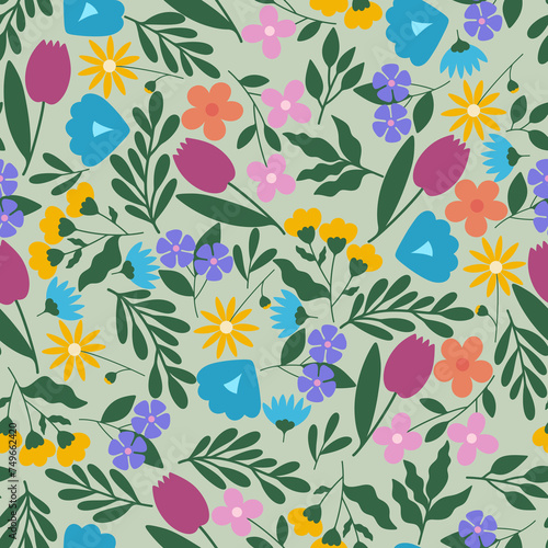 Colorful floral seamless pattern. Hand drawn flat flowers scattered on green background. Cheerful bright wildflowers raster allover backdrop. A lot of leaves branches and blue, pink and purple flowers