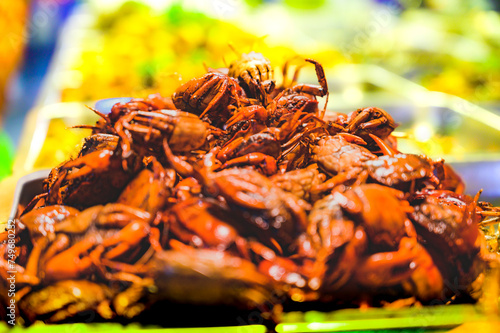 Fried rice field crabs with salt and pepper on a food stall
