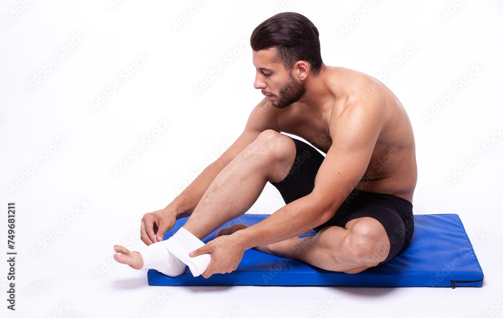 Sports guy with elastic bandage on his leg Sports guy with elastic bandage on his leg