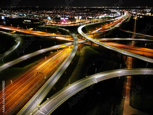 Aerial view at night of a cloverleaf interchange highway, The Haque, Holland © corlaffra