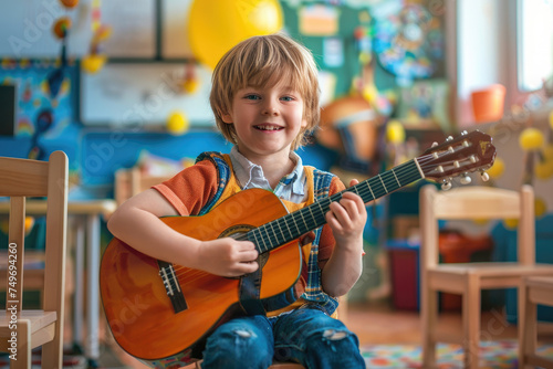 Cheerful kid playing guitar in kindergarten classroom