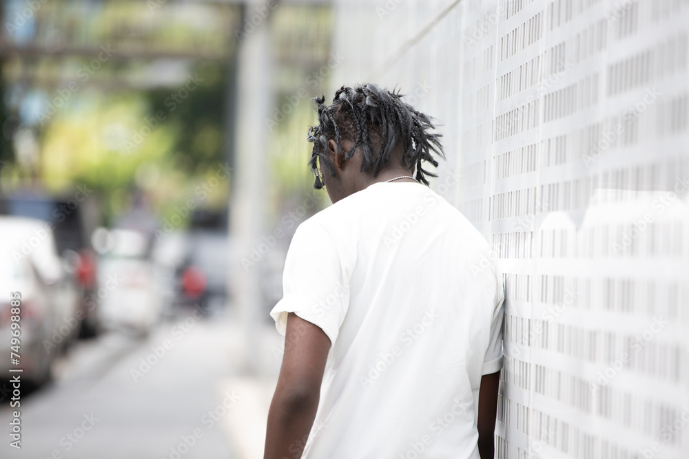 Portrait of young African American male in the city outdoor. Young black male people at outdoor. Fashion concept Portrait of young African American male in the city outdoor. Young black male people at outdoor. Fashion concept