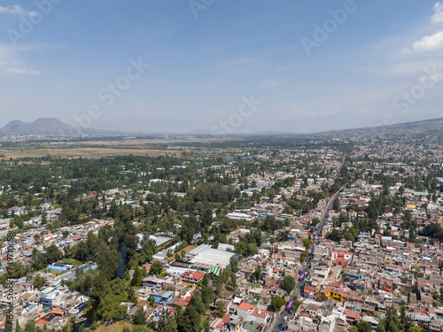 Fototapeta Naklejka Na Ścianę i Meble -  Aerial views of the southeast of Mexico City, Xochimilco in the foreground