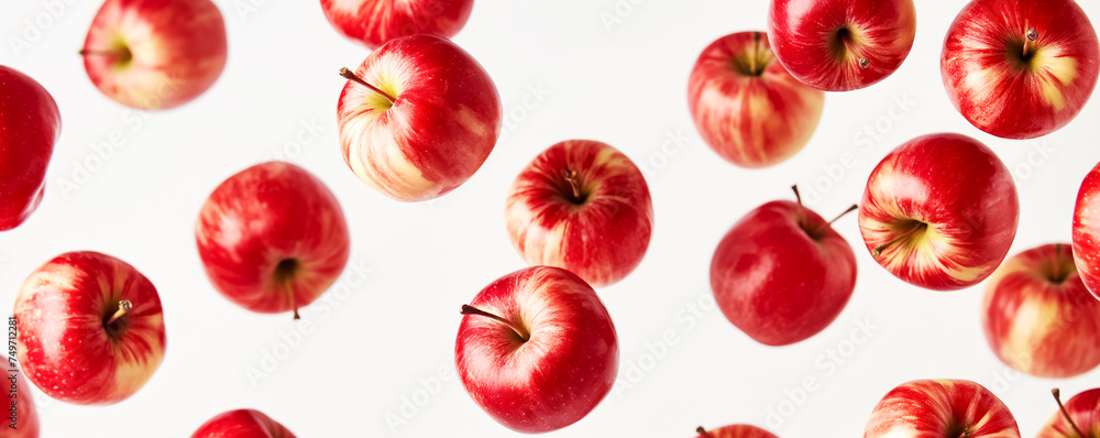 Red and Yellow Apples Floating on White Background Red and Yellow Apples Floating on White Background