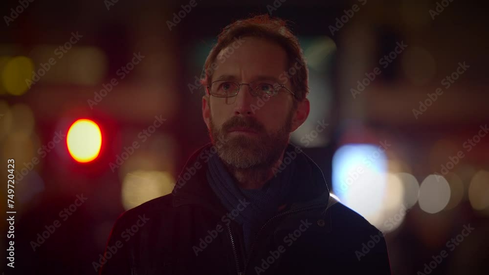 Male Person Thinking and Looking at Colorful Urban Neon Light Outside Male Person Thinking and Looking at Colorful Urban Neon Light Outside