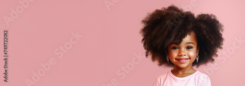 Cute little black girl on pink background, banner