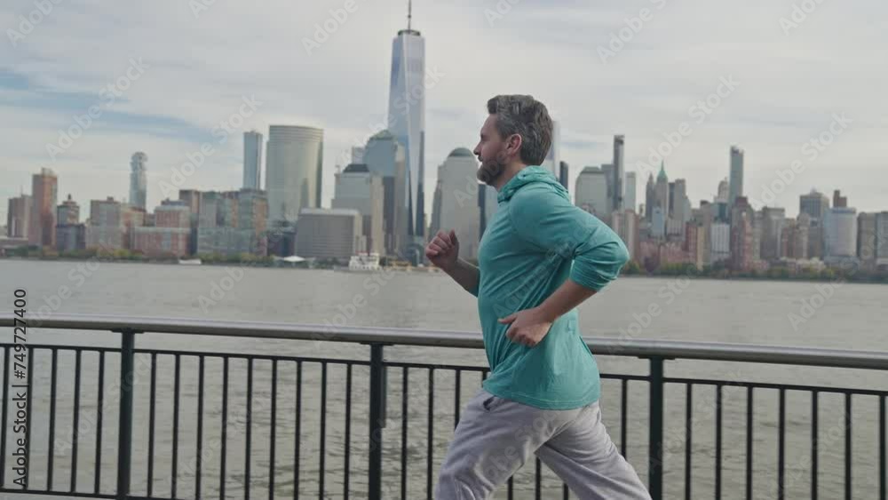 Running Man. Mature man running in NYC and workout. Senior male runner running outdoor. Sport motivation. Fitness and healthy exercise running. Elderly person exercise, jogging. American fitness. Running Man. Mature man running in NYC and workout. Senior male runner running outdoor. Sport motivation. Fitness and healthy exercise running. Elderly person exercise, jogging. American fitness.
