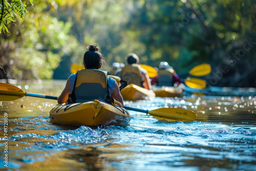 Group of Friends on a Kayaking Trip Navigating a Tranquil River Surrounded by Nature © KirKam